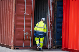 inspector-checking-container-yard-organising-stock-2023-08-18-06-48-05-utc-min2